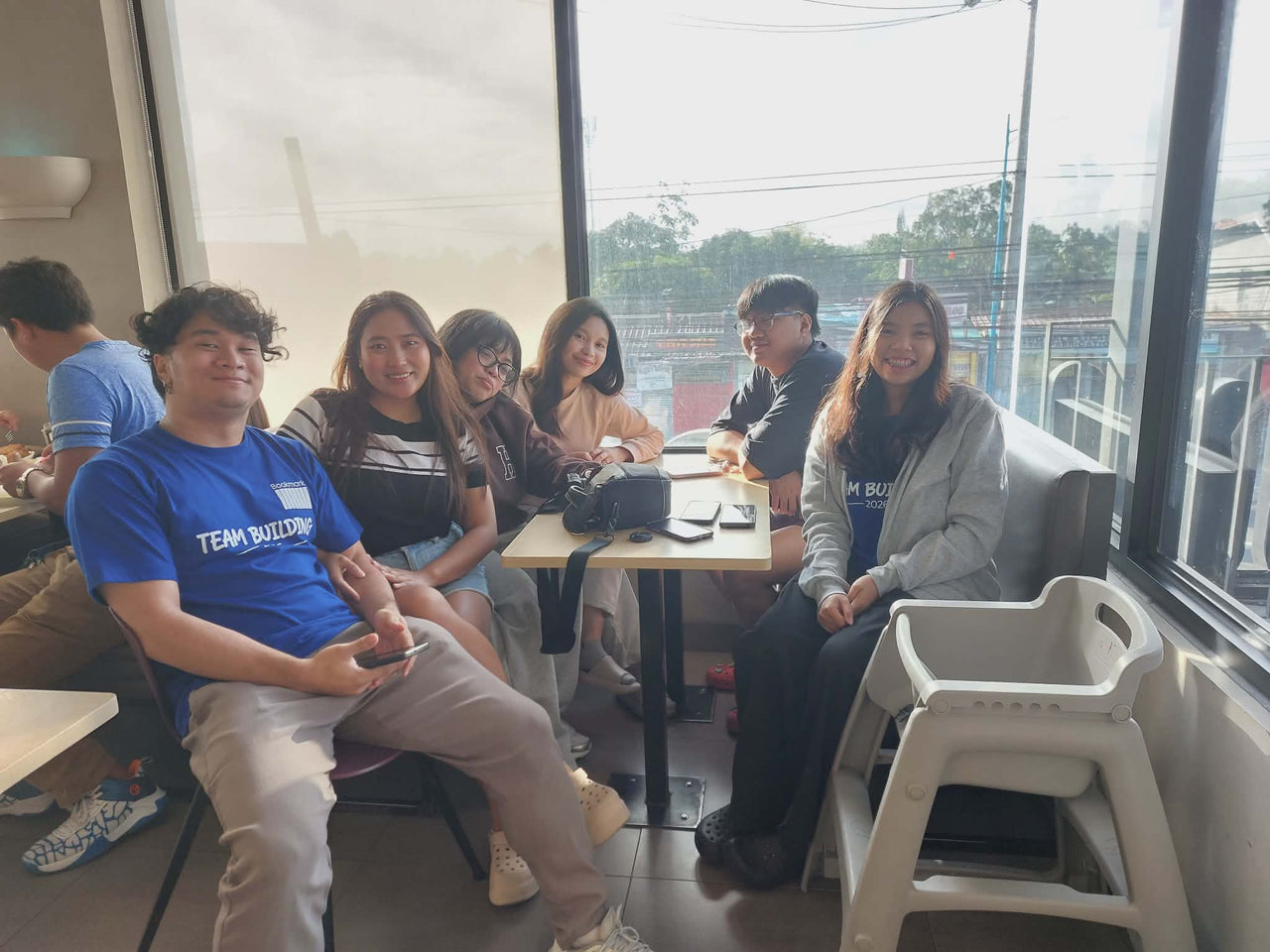 Bookmark team gathered by the pool at Playfarm Tagaytay during Team Building 2026